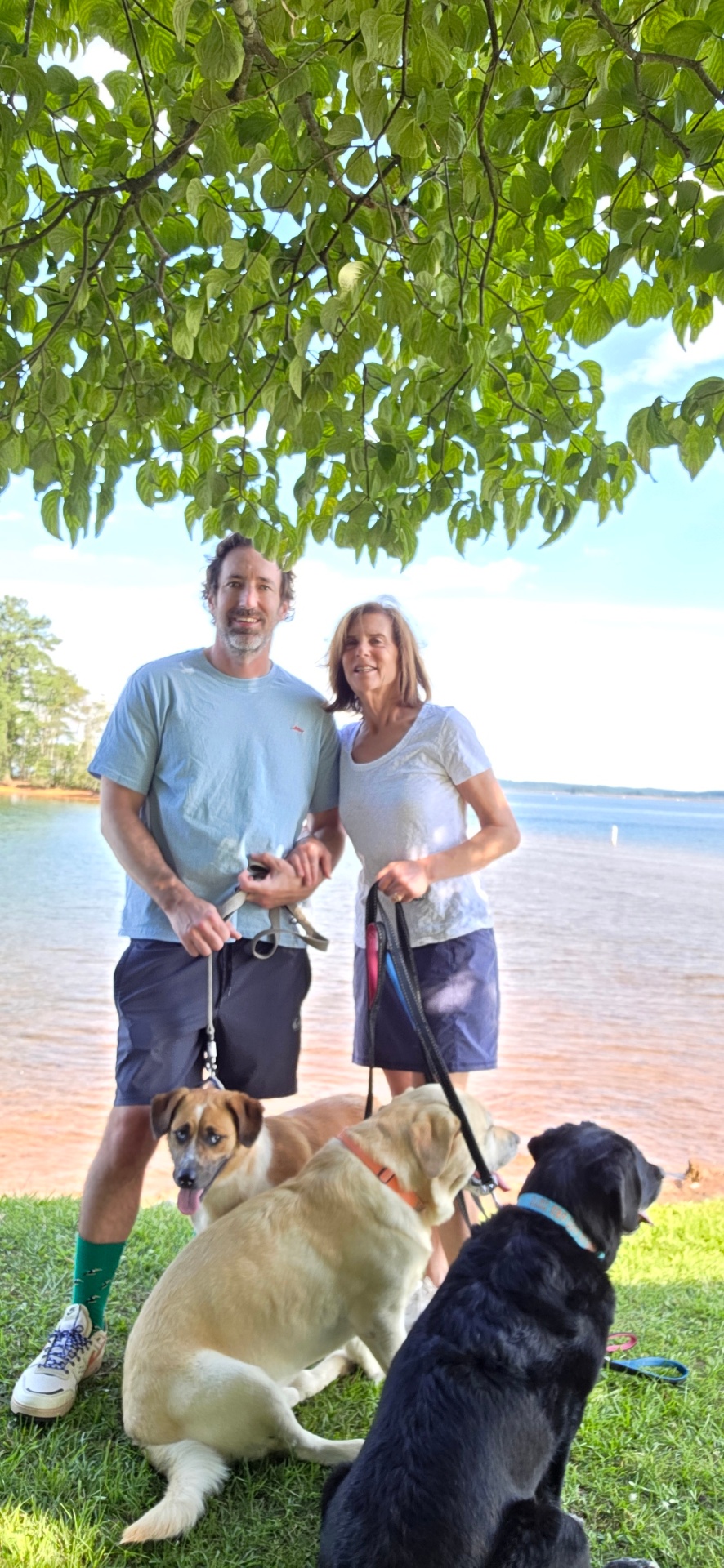Patrick and family with their dogs by the lake
